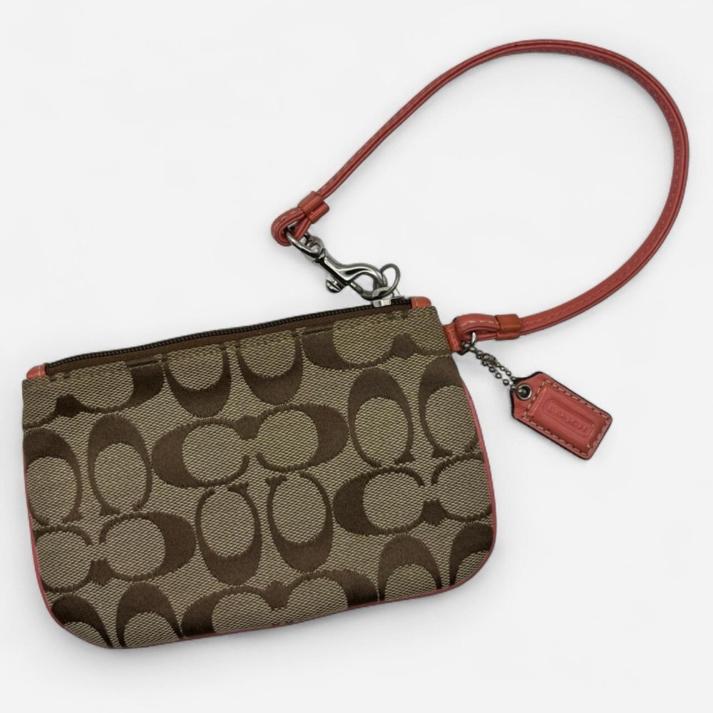 Coach Signature C Monogram Brown and Tan Wristlet with a Peach Coral Trim & Tag